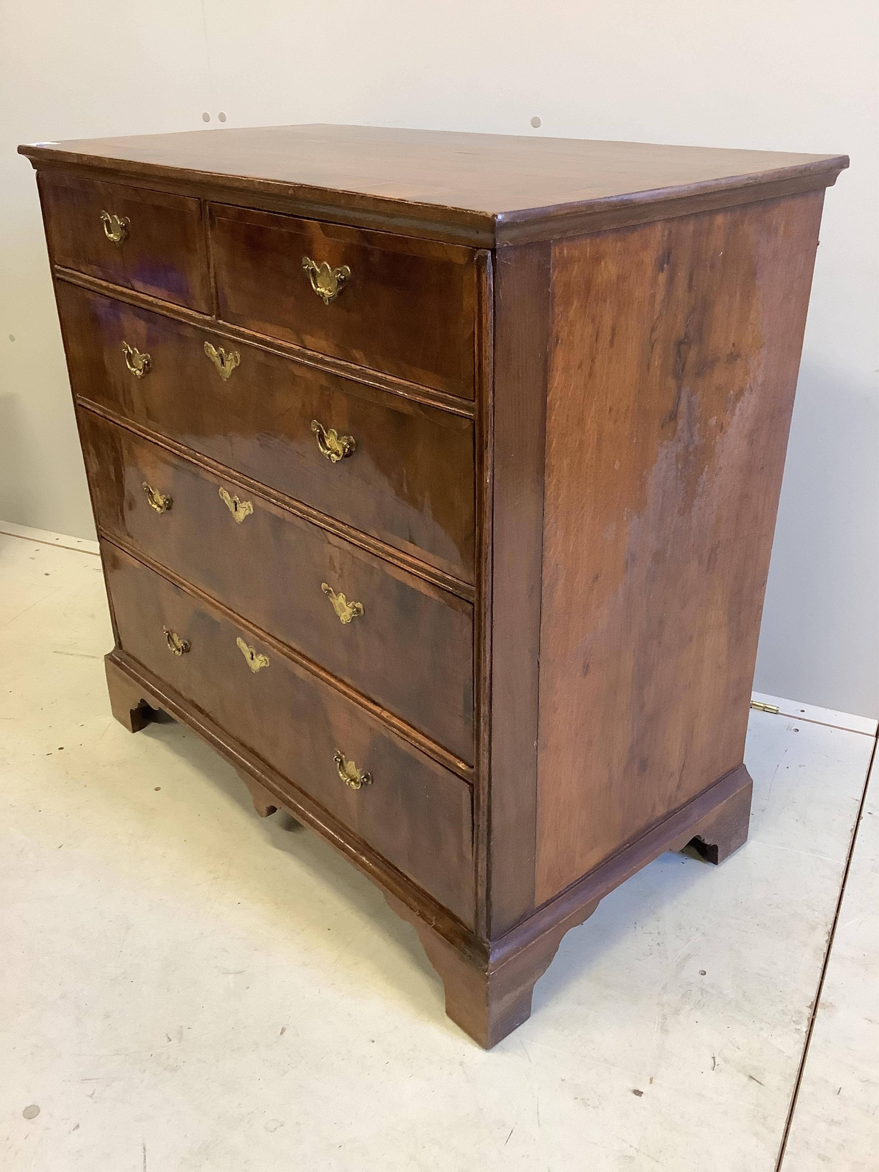 An early 18th century banded walnut chest, fitted two short and three long drawers, width 90cm, depth 49cm, height 89cm. Condition - good